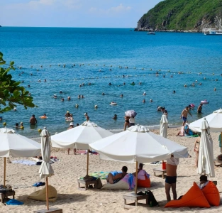 Dadonghai beach with tourists swimming and relaxing