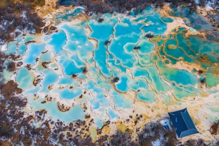 Huanglong Scenic Area turquoise travertine pools aerial view in Huanglong National Park China