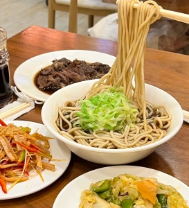 Traditional beef noodle soup at Old Beijing Chaishi in Sanlitun