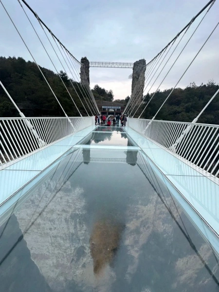 Riverside area near the glass bridge with walking paths