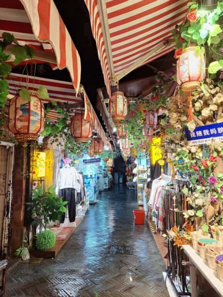 Tianzifang alleyway with shops and lanterns, a vibrant arts district in Shanghai, China