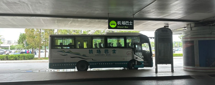Airport shuttle bus stop outside Dalian Zhoushuizi International Airport