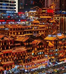 Hongya Cave at night, traditional stilted buildings with bright lights in Chongqing