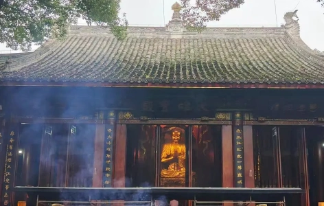 Main hall of Lingyun Temple with incense smoke rising