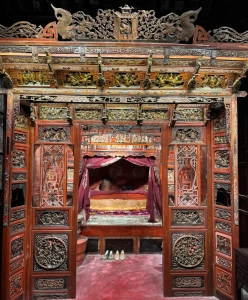 Shen House interior with traditional Chinese canopy bed