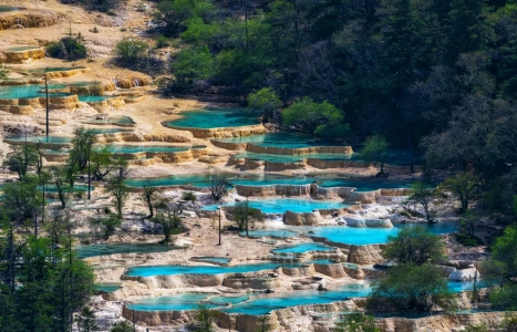 Huanglong colorful travertine pools in Huanglong Scenic Area Sichuan China