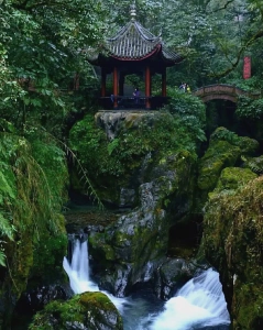 Qingyin Pavilion over waterfall in Mount Emei forest