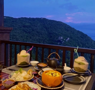 Scenic dining table with tropical cuisine and mountain view at Yalong Bay Forest Park