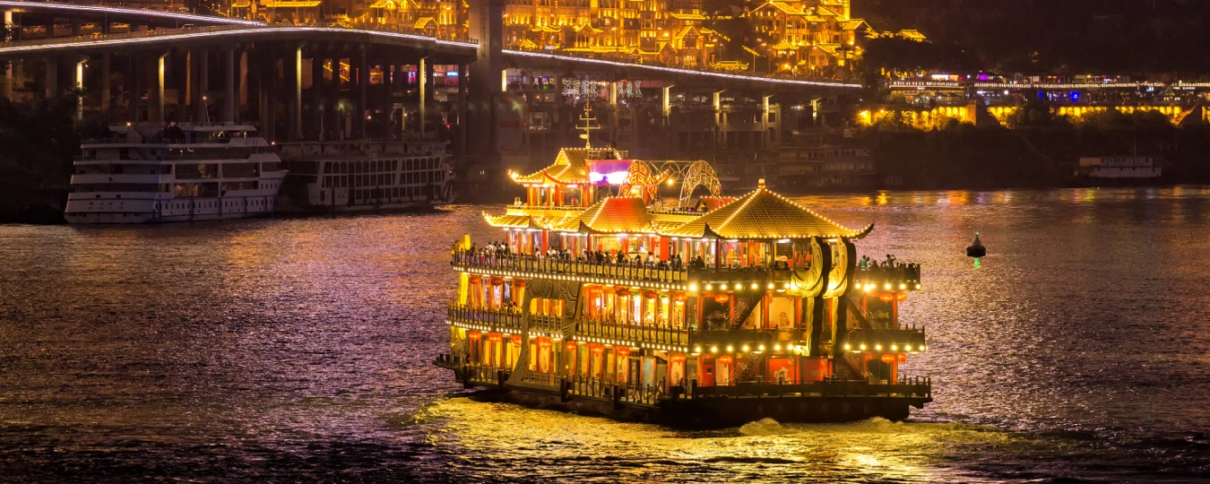 Traditional-style cruise ship illuminated on Chongqing’s Two Rivers Night Cruise