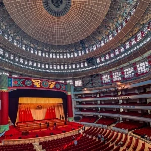Interior auditorium of The Peoples Great Hall of Chongqing with red seats