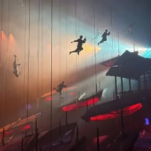 Aerial performers and suspended boats in a climactic scene of Chongqing 1949
